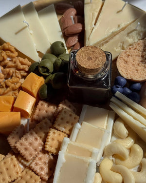 Decorative candle in the shape of a cheese board